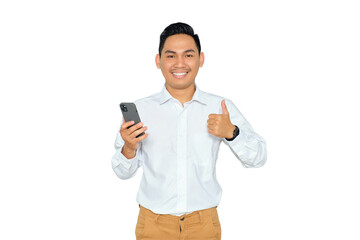 Portrait of smiling young Asian man in formal wear holding mobile phone and giving thumbs up,...