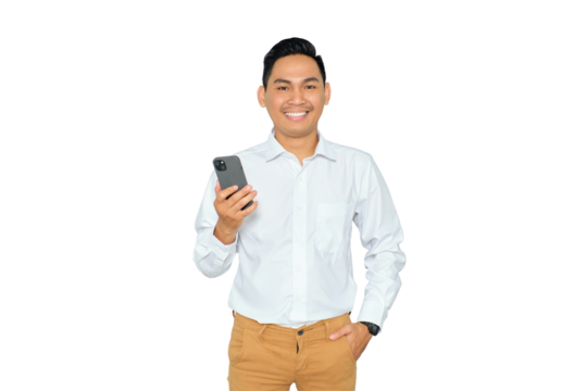 Portrait of happy young Asian man in formal wear holding smartphone and looking at camera with smile isolated on transparent background - Powered by Adobe
