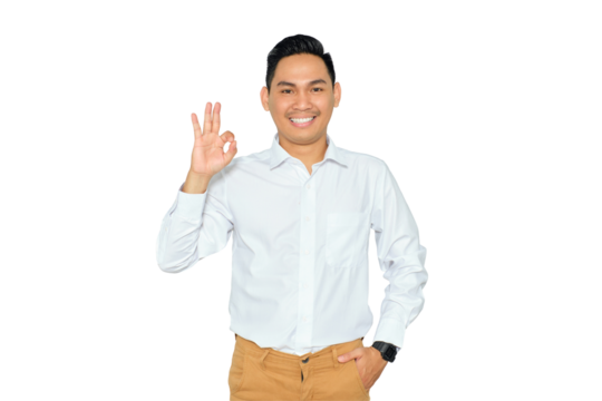 Portrait of happy young Asian man in formal wear showing ok sign with finger and looking at camera with smile isolated on transparent background