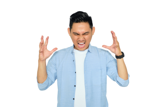 Portrait of angry young Asian man in casual clothes raising hands and screaming with aggressive expression isolated on transparent background