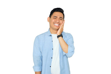 Dental problems. Unhappy young Asian man in casual clothes suffering from severe toothache,...