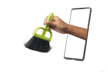 a hand emerging from a smartphone screen, holding a small green dustpan brush, symbolizing digital...