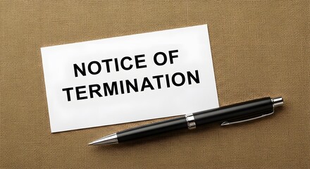 Termination Notice on Desk with Pen
