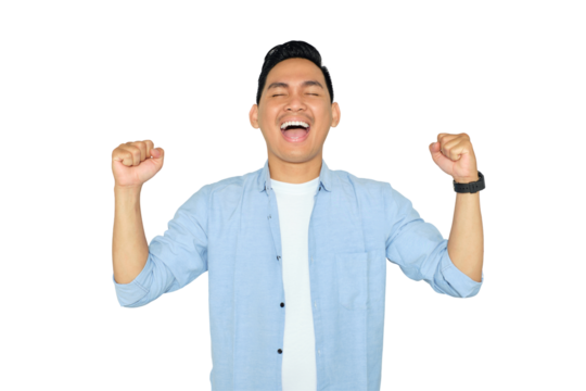 Excited young handsome Asian man in casual clothes making winner gesture with raising fist, celebrating success isolated on transparent background. Goal achievement concept