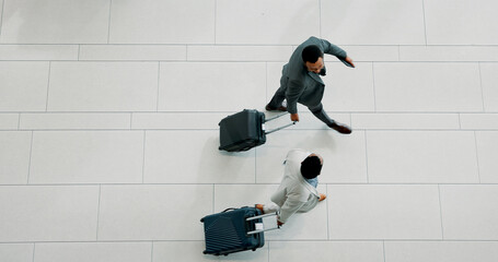 Businessmen, walking and travel with suitcase above for corporate commute or job opportunity. Top...