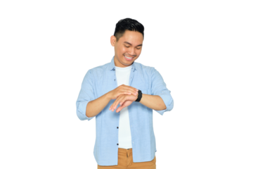 Happy young Asian man in casual clothes looking at his watch to check time isolated on transparent background