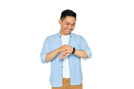 Happy young Asian man in casual clothes looking at his watch to check time isolated on transparent background