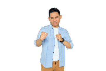 Angry young Asian man in casual clothes ready to fight with fist defense gesture isolated on transparent background