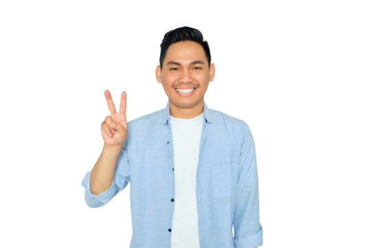 Portrait of happy young Asian man in casual clothes showing victory sign, looking at camera with cheerful smile isolated on transparent background - Powered by Adobe