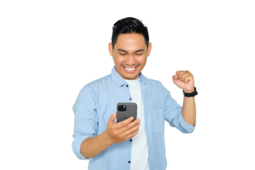 Happy young Asian man in casual clothes using mobile phone for trading or chatting and making winning gesture isolated on transparent background