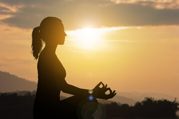 Silhouette woman meditate outdoor