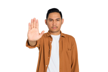 Unhappy young Asian man in casual shirt making stop gesture with his hands isolated on transparent background