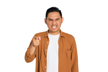 Upset young Asian man in casual shirt pointing at you with index finger isolated on transparent...