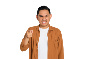 Upset young Asian man in casual shirt pointing at you with index finger isolated on transparent background