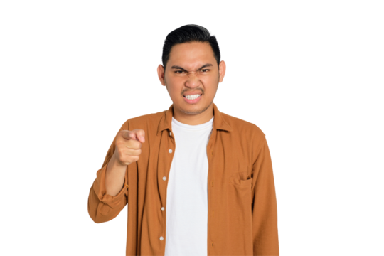 Upset young Asian man in casual shirt pointing at you with index finger isolated on transparent background - Powered by Adobe