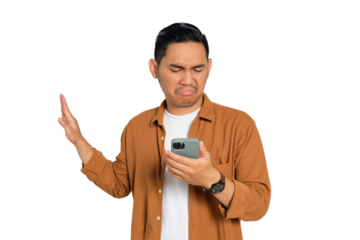 Handsome young Asian man in casual shirt looking at smartphone reading news and doing stop sign with hand isolated on transparent background