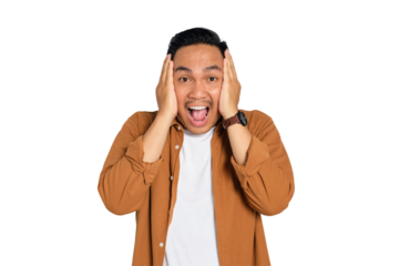 Portrait of surprised young Asian man in casual shirt looking at camera with opened mouth isolated on transparent background