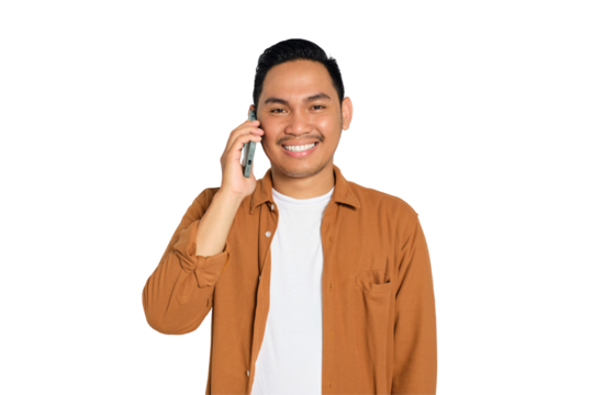 Smiling young Asian man in casual shirt talking on mobile phone, good talk with friend isolated on transparent background