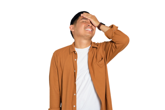 Forgetful young Asian man in casual shirt slapping hand on head having duh moment isolated on transparent background