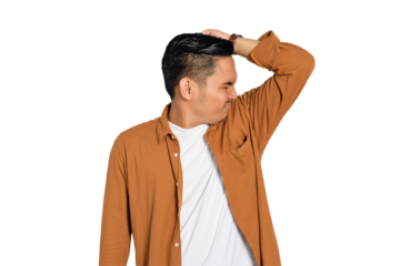 Portrait of young Asian man in casual shirt sniffing his armpit, bothered by body odor isolated on transparent background