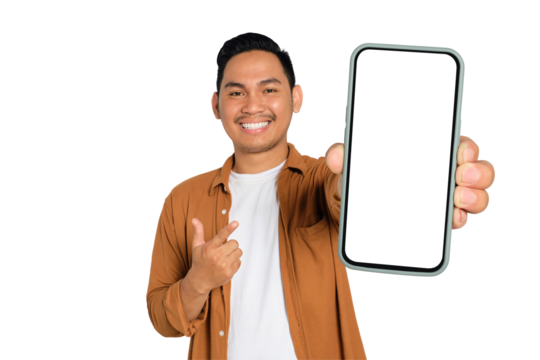 Excited young Asian man in casual shirt holding smartphone with blank screen, pointing at device isolated on transparent background