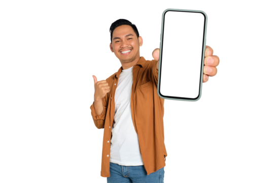 Happy young Asian man in casual shirt showing smartphone with blank screen and thumb up isolated on transparent background