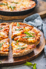 Fresh homemade Italian pizza with ham and buffalo mozzarella