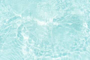 Blue water with ripples on the surface. Defocus blurred transparent blue colored clear calm water...