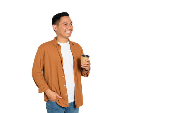 Happy young Asian man in casual shirt holding hot coffee cup isolated on transparent background