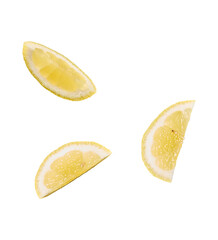 Three fresh lemon slices with pulp and rind isolated on transparent background