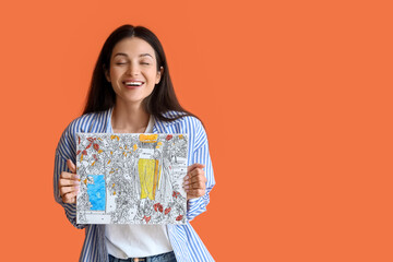 Young woman with painting by numbers on orange background