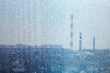 raindrops on wet glass abstract background on the backdrop of the sky