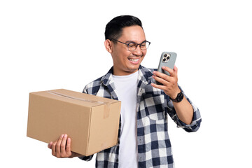 Happy young Asian man in casual shirt holding package box and using mobile phone for online shopping isolated on transparent background