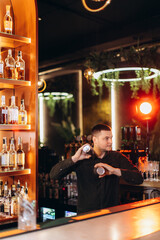 Bartender Preparing Cocktail in a Vibrant Modern Bar Environment