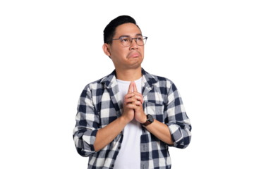 Pensive young Asian man in casual shirt looking up, thinking and making decision isolated on transparent background