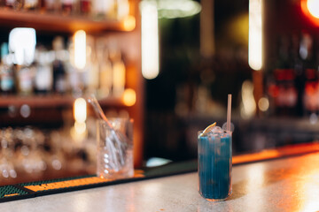 Colorful Blue Cocktail on a Stylish Bar Counter at Night