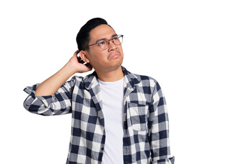 Doubtful young Asian man in casual shirt scratching head, thinking, trying to find solution...