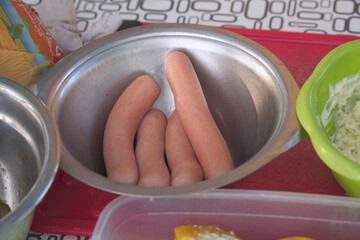 Sausages for cooking in iron plate
