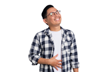 Happy young Asian man in casual shirt feeling happy after eating delicious food, rubbing belly and smiling isolated on transparent background