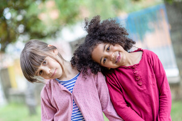 tWo girlfeidns different skin color best friends hanging out loving each other