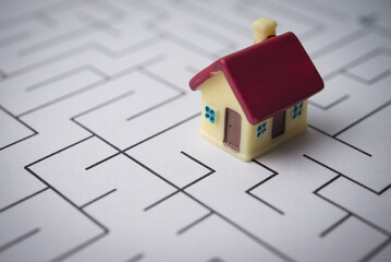 House in complex maze. Home finance, housing problem and solution, mortgage loan high interest rate, financial planning in economy crisis, risk management, home insurance and so on concept.