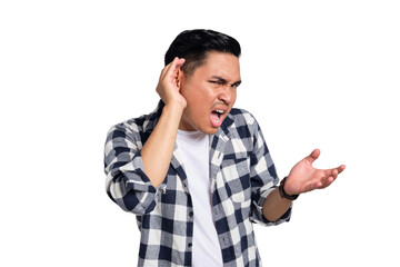 Can't hear you. Curious young Asian man in casual shirt holding hand near ear, trying to listen to...
