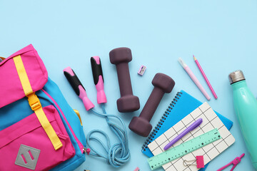 Composition with backpack, school supplies and sports equipment on blue background