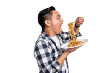 Happy young Asian man in casual shirt enjoying eating noodles with fork isolated on transparent background