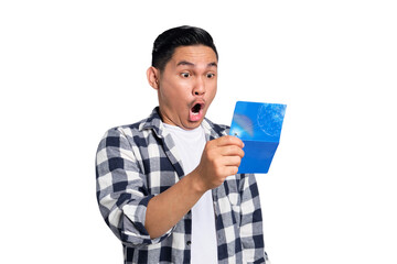 Surprised young Asian man in casual shirt looking at saving account passbook isolated on...
