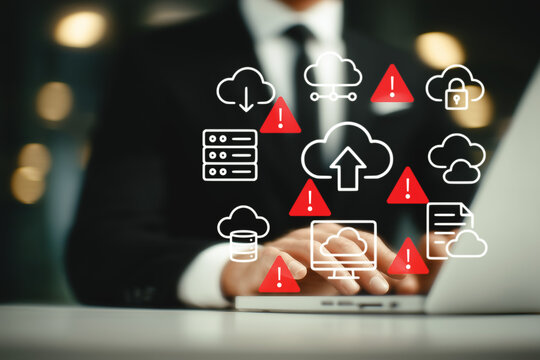 Businessman using laptop with cloud computing icons and red warning alerts. Concept of cyber attack, data breach, internet security threat, virus, spyware, and cloud vulnerability. generative ai