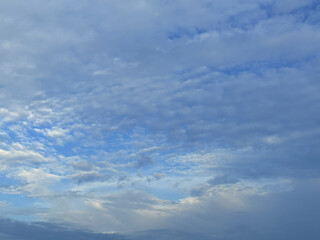 Blue sky background and white clouds soft focus image. Clear blue color sky with white clouds.
