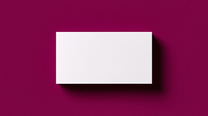 Fototapeta premium Minimalist blank white card centered on a vibrant purple background with soft shadow, ideal for branding, invitation mockups, or minimalist design presentations.