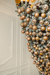 This Elegant Christmas Door Decor features gold and silver ornaments arranged to create a festive...