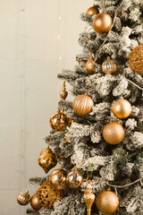 An Elegant Golden Christmas Tree, beautifully decorated with Shimmering Ornaments and adorned with...